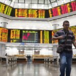 Asian shares decline as oil prices soar amid war in Iran, echoing last week’s Wall Street drop