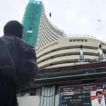 Sensex, Nifty erase early gains to settle flat in volatile trade as crude oil rebounds
