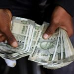 Rupee falls 10 paise to close at 93 against USD