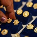 Gold falls on stronger dollar amid renewed U.S.-Iran tensions